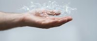 Caucasian male hand holding translucent water splash with red fish inside against neutral background, representing aquaculture, sustainability, and environmental conservation concepts.