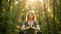 Young Caucasian woman practicing yoga meditation in peaceful forest setting with golden sunlight filtering through trees creating serene wellness atmosphere.