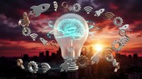 Glowing light bulb with brain inside surrounded by technology icons against dramatic sunset cityscape backdrop for innovation and business concepts.