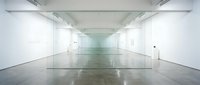Modern minimalist gallery interior with white walls and polished concrete floors featuring clean architectural lines for contemporary art exhibitions.