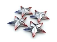 Patriotic star shaped metallic ornaments with red, white and blue coloring arranged on white background, suitable for holiday designs, greeting cards and festive decorations.