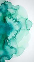 Abstract turquoise watercolor paint splash with organic flowing shapes and translucent layers on white paper background for artistic design projects.