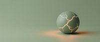 Cracked sphere with golden light leaks on muted sage background, symbolizing broken potential, failure, or transformation in business and creative concepts.
