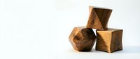 Stacked wooden geometric blocks with natural grain texture on white background, suitable for design, architecture, and creative projects.