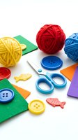 Colorful craft supplies with yarn balls, scissors, buttons and felt pieces on white background for creative sewing and knitting projects.