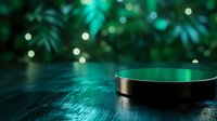 Metallic round platform on dark wooden surface with green bokeh lights and plant silhouettes in background creating magical atmosphere.