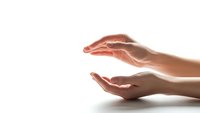 Protective cupped hands gesture on white background isolated for care, safety and support concepts in healthcare and insurance design applications.
