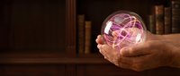 Elderly hands holding a glowing crystal ball with swirling purple and gold energy, mystic library background, fortune telling concept.