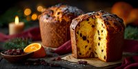 Traditional Italian panettone Christmas bread with candied fruits and raisins, festive holiday baking dessert on wooden table with warm candles bokeh background.