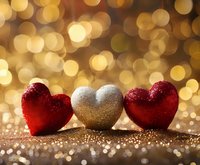 Glittering red and silver heart decorations against golden bokeh background, perfect for Valentine's Day or romantic celebrations.