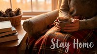 Woman in cozy sweater holding warm coffee cup under plaid blanket by window with pine cones and books, Stay Home text overlay.