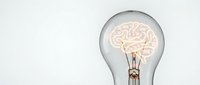 Light bulb with glowing brain filament representing creative thinking, innovation and bright ideas for business concepts and educational materials.