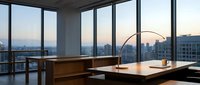 Modern office workspace with floor-to-ceiling windows overlooking city skyline at sunset, featuring wooden desk, minimalist furniture and urban views for corporate business environments.
