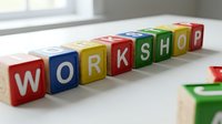 Colorful wooden alphabet blocks spelling WORKSHOP arranged in row on white surface. Educational toys for children learning letters and words.
