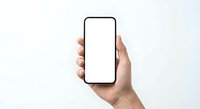 Hand holding modern smartphone with blank white screen mockup against clean white background for app presentation and digital marketing materials.