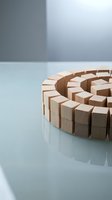 Wooden blocks arranged in spiral pattern on reflective surface representing growth, teamwork and business development concepts for corporate presentations.