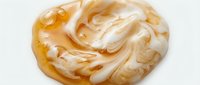 Caramel and white swirled abstract liquid paint texture on isolated white background, ready for design projects and digital artwork applications.
