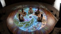 Group meditation session with diverse people sitting in circle on illuminated mandala floor projection for wellness and mindfulness practice.