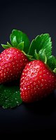 Fresh ripe strawberries with water drops and green leaves on dark background, macro shot showing detailed texture and vibrant colors. Perfect for food marketing.