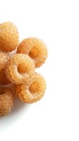 Fresh golden raspberries isolated on white background for healthy eating and organic food design projects.