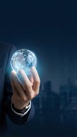 Businessman holding glowing digital globe with network connections against dark cityscape background for global business, technology, and innovation concepts.