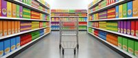 Supermarket aisle with empty shopping cart surrounded by colorful packaged products on shelves, representing retail grocery shopping and consumer purchasing decisions.