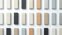 Assorted fabric swatches and material samples in neutral tones including cream, beige, gray, black and natural wood textures arranged in rows for interior design and home decor selection.