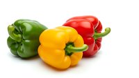 Fresh colorful bell peppers in green, yellow and red isolated on white background for healthy cooking and nutrition concepts.