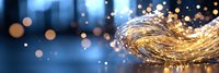 Golden glowing wave with sparkling light particles against dark blue background, creating magical festive atmosphere with bokeh effect.