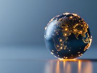 Glowing globe showing Earth city lights at night with illuminated continents on dark blue background, reflecting on glossy surface. Global connectivity concept.