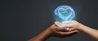 Hands holding glowing digital brain hologram representing artificial intelligence, mental health awareness, neuroscience research and cognitive technology concepts.