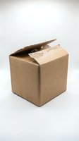 Open brown cardboard shipping box with packaging material inside on white background for delivery and logistics concepts.
