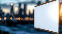 Empty white screen against blurred urban cityscape background with bokeh lights during sunset, mockup for outdoor advertising and presentation display.
