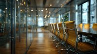 Modern corporate boardroom with leather executive chairs around glass conference table in contemporary office building with city views.