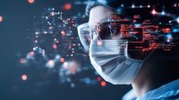 Asian male medical professional wearing protective face mask and glasses with futuristic digital data visualization overlay in red and blue tones against dark background.