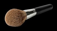 Fluffy powder makeup brush with soft brown bristles and black handle, isolated on transparent background. Great for beauty clipart, stickers, t-shirt design, and print on demand.