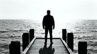 Male figure in dark clothing standing on wooden pier extending into calm ocean waters, viewed from behind, contemplative mood, monochromatic seascape with horizon line, solitude and reflection concept for meditation and mindfulness themes.