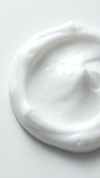 Creamy white moisturizer or lotion texture with smooth swirls, isolated on light background. Suitable for skincare, cosmetics, beauty product packaging, and wellness marketing materials.