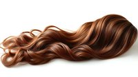 Flowing wavy auburn hair with copper highlights isolated on white background for beauty salon advertising and hair care product marketing campaigns.