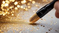 Makeup brush sweeping golden glitter powder on dark surface with sparkling bokeh lights and scattered shimmer particles creating magical cosmetic effect.