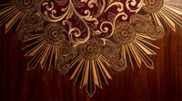 Ornate golden baroque decorative pattern with intricate swirls and radial sunburst design on rich burgundy background for luxury branding and elegant projects.