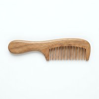 Wooden hair comb with handle isolated on white background, ready for haircare product design, grooming tool packaging, and beauty retail use.