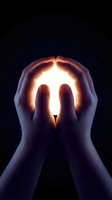 Cupped hands holding glowing light against dark background symbolizing hope, protection, spirituality and inner strength for meditation concepts.