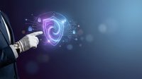 Businessman pointing at glowing cybersecurity shield with digital lock icons and network connections on dark blue background for technology presentations.