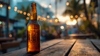 Cold beer bottle with condensation on wooden table at sunset, bokeh lights creating warm ambiance for restaurant or bar advertising.