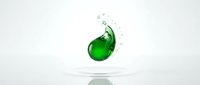 Green liquid splash creating dynamic wave motion with droplets against clean white background for product photography and advertising campaigns.