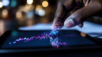 Finger touching digital tablet screen with glowing financial chart visualization, sparkles and bokeh lights creating magical data analysis moment.