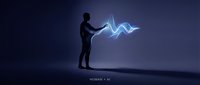 Silhouette of man in business attire interacting with glowing blue digital wave energy, representing human connection with artificial intelligence and technology innovation.