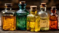 Vintage glass bottles with cork stoppers containing colorful liquids in amber, emerald, yellow and orange hues for apothecary and laboratory themes.