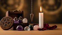 Mystical altar setup with pentagram, crystals, candle, pendulum and rose petals for spiritual rituals and divination practices.